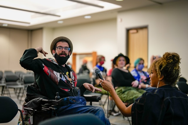 People in wheelchairs take part in a job training program.